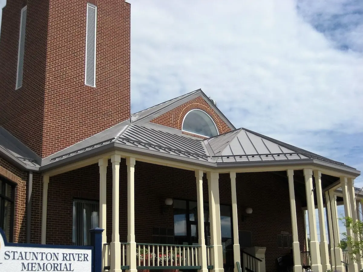 Skilled roofing craftsmen working on a residential roof in Ranson corporation
